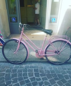 Bicycles parked on sidewalk in city