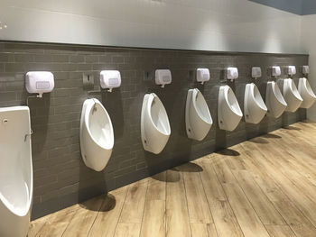 Row of objects on wall in bathroom