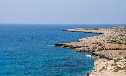 Scenic view of sea against clear sky