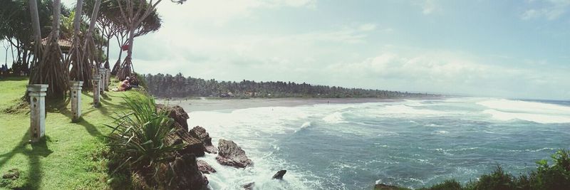 Scenic view of sea against cloudy sky