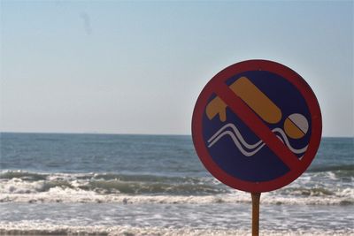 Warning sign on sea
