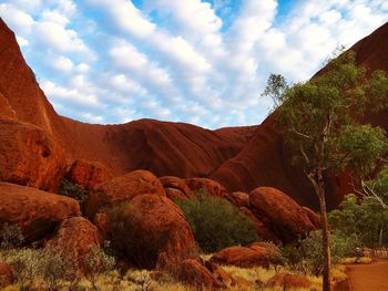 Scenic view of mountains against cloudy sky