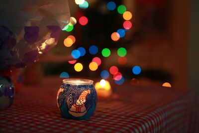 Close-up of illuminated christmas lights on table