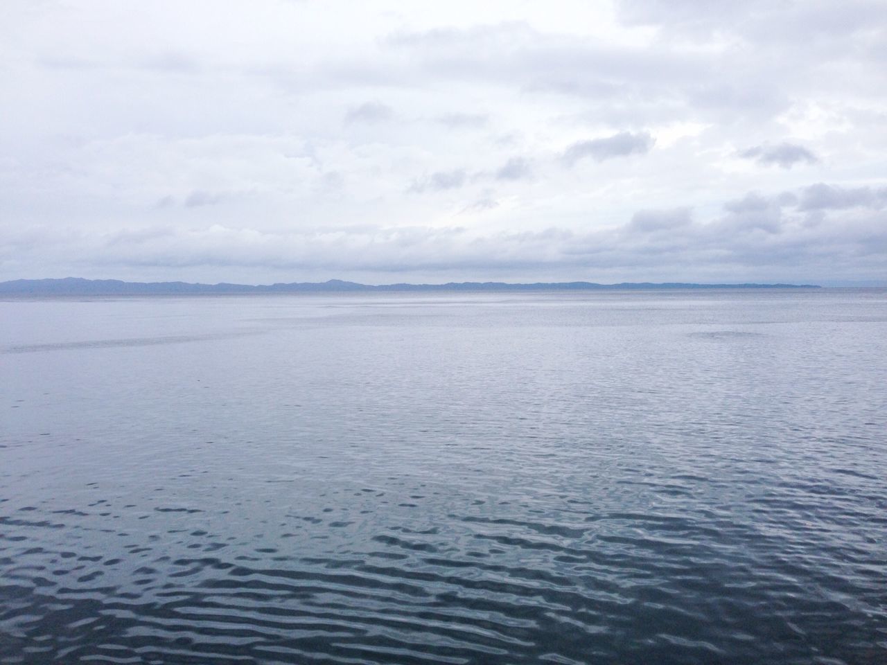 water, tranquil scene, sky, tranquility, scenics, sea, waterfront, beauty in nature, rippled, cloud - sky, nature, cloud, idyllic, cloudy, day, seascape, horizon over water, outdoors, remote, no people