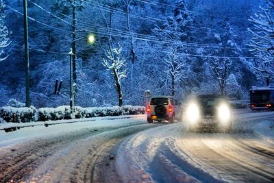 Road passing through snow covered landscape