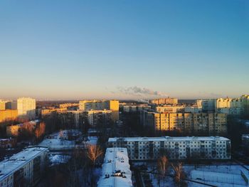 High angle view of buildings against sky during winter