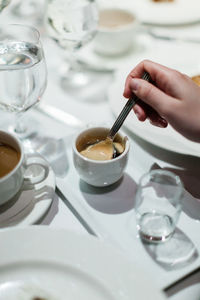 Midsection of coffee cup on table