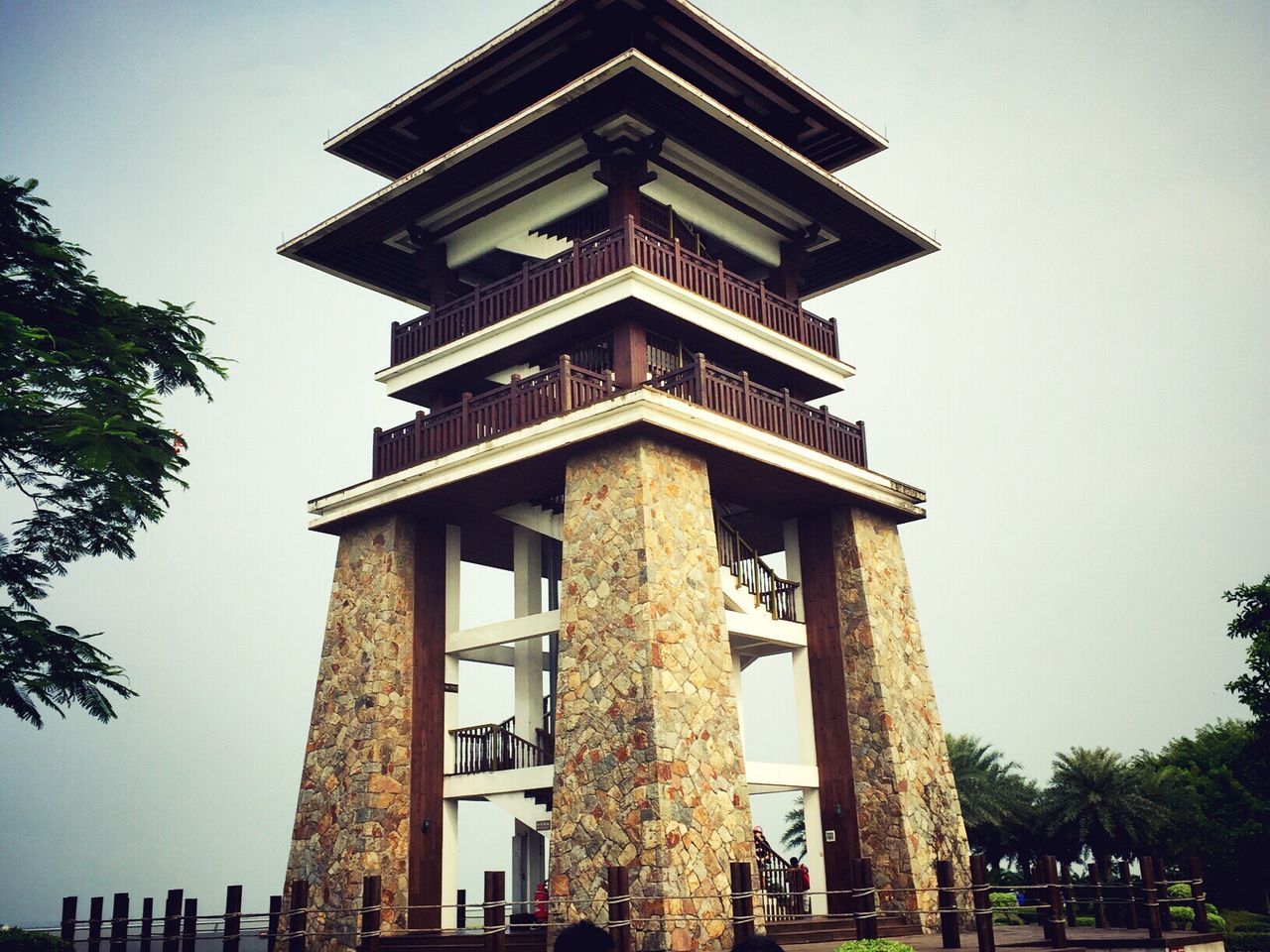 architecture, built structure, low angle view, tree, sky, day, outdoors, travel destinations, architectural column, no people, facade, exterior, tall - high, tourism, architectural feature