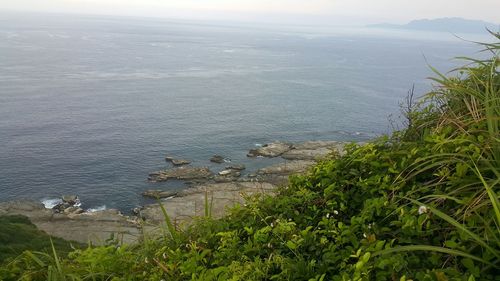 High angle view of sea shore against sky