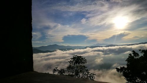 Scenic view of silhouette mountains against sky at sunset