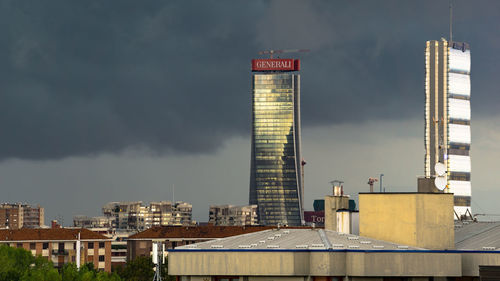 Buildings in city against sky