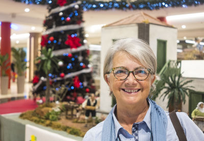 Portrait of smiling senior woman at mall