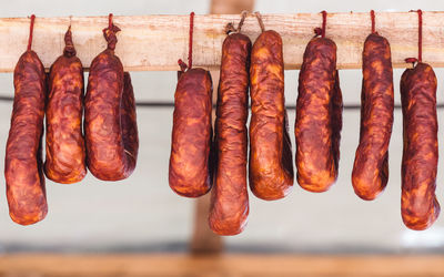 Close-up of meat hanging in row