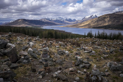 Scenic view of mountains against cloudy sky