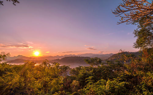 Scenic view of landscape against sky during sunset