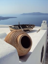 Earthenware and abandoned boat on rooftop