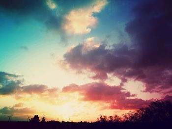 Silhouette landscape against dramatic sky