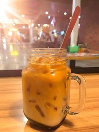 Close-up of milk tea drink in jar on table