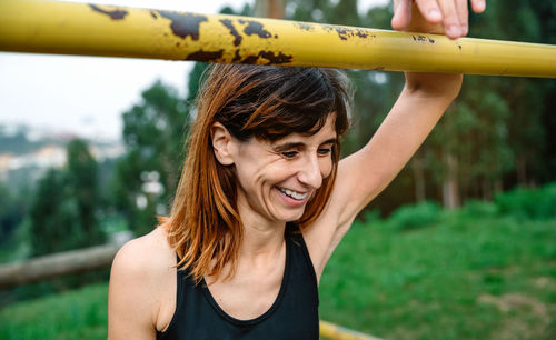 Portrait of smiling young woman outdoors