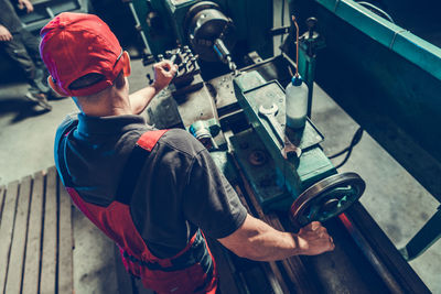 Portrait of young man working in factory