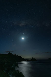 Scenic view of lake against star field at night