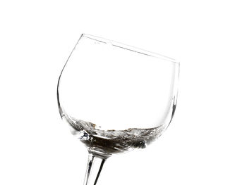 Close-up of glass over white background