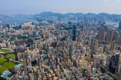 High angle view of modern buildings in city against sky