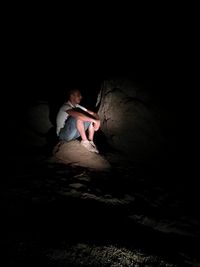 Man sitting in cave