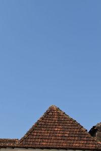 Low angle view of building against blue sky