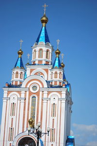 Low angle view of building against blue sky