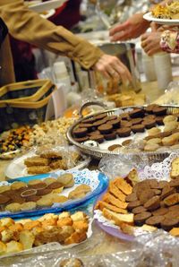 Cropped image of people with sweet food while celebrating thanksgiving