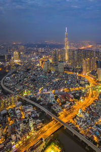 High angle view of city lit up at night