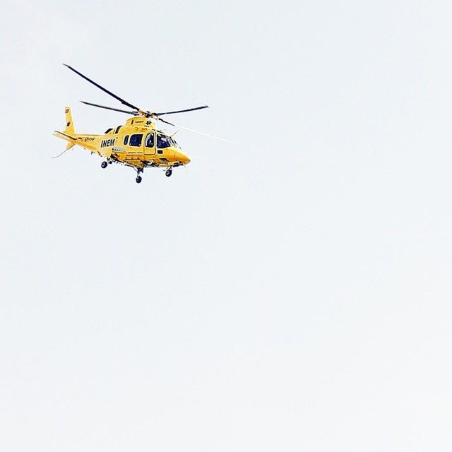 transportation, low angle view, mode of transport, flying, mid-air, clear sky, copy space, air vehicle, airplane, helicopter, travel, outdoors, on the move, sky, day, journey, fun, yellow, motion, no people