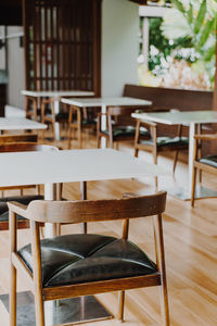 Empty chairs and tables in cafe