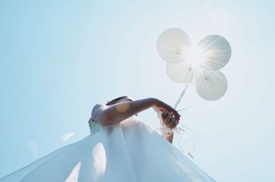 Low angle view of flowers against sky