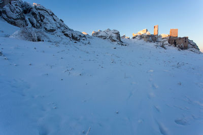 Scenic view of snowcapped mountains against clear sky