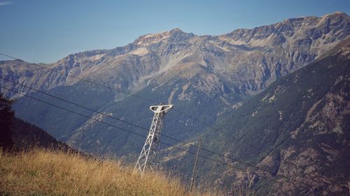 Mountains landscape with cableway trellis - vintage style photo 
