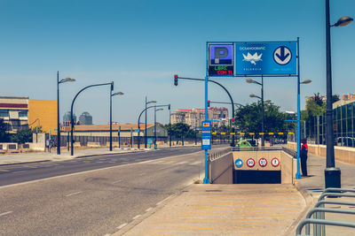 Road sign against blue sky