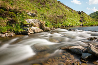 Long exposure of the river heddon flowing into heddons mouth on the north devon coast