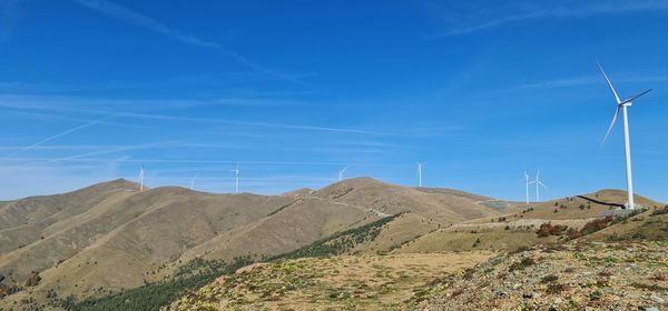 Low angle view of mountain against blue sky