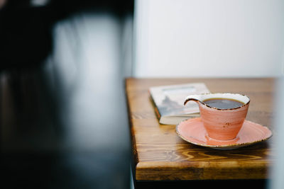 Close-up of coffee cup on table