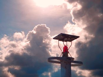 Low angle view of cross against sky during sunset