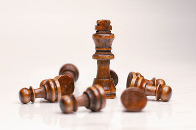 Close-up of chess pieces against white background