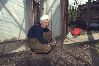 Full length of farmer working at farm