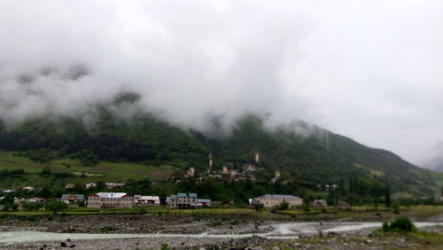 Scenic view of mountains against cloudy sky