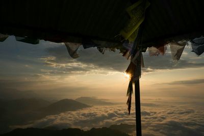 Scenic view of mountains against sky at sunset