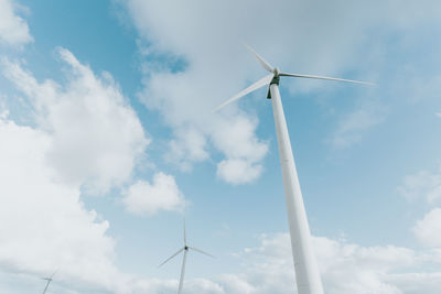 Low angle view of windmill against sky