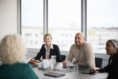 Smiling people at business meeting