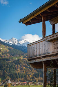 Wooden balcony in front of mountains in the austrian alps