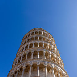 Low angle view of historical building against blue sky